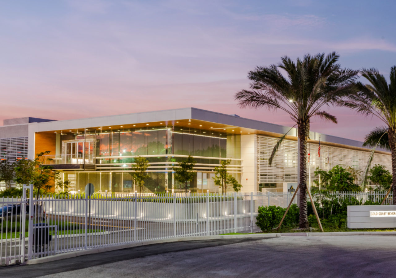 Exterior View at Dusk of Gold Coast Beverage Distribution Facility in Pompano Beach, FL